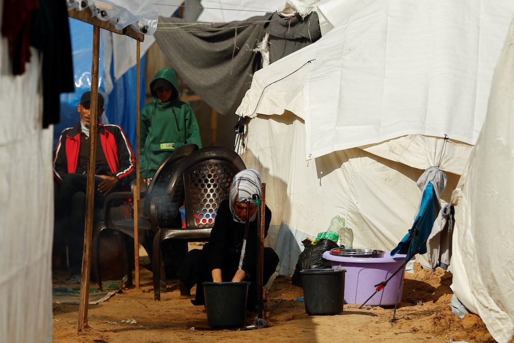 Displaced Palestinians take shelter, amid the ongoing conflict between Israel and Palestinian Islamist group Hamas, in a tent camp in Khan Younis.