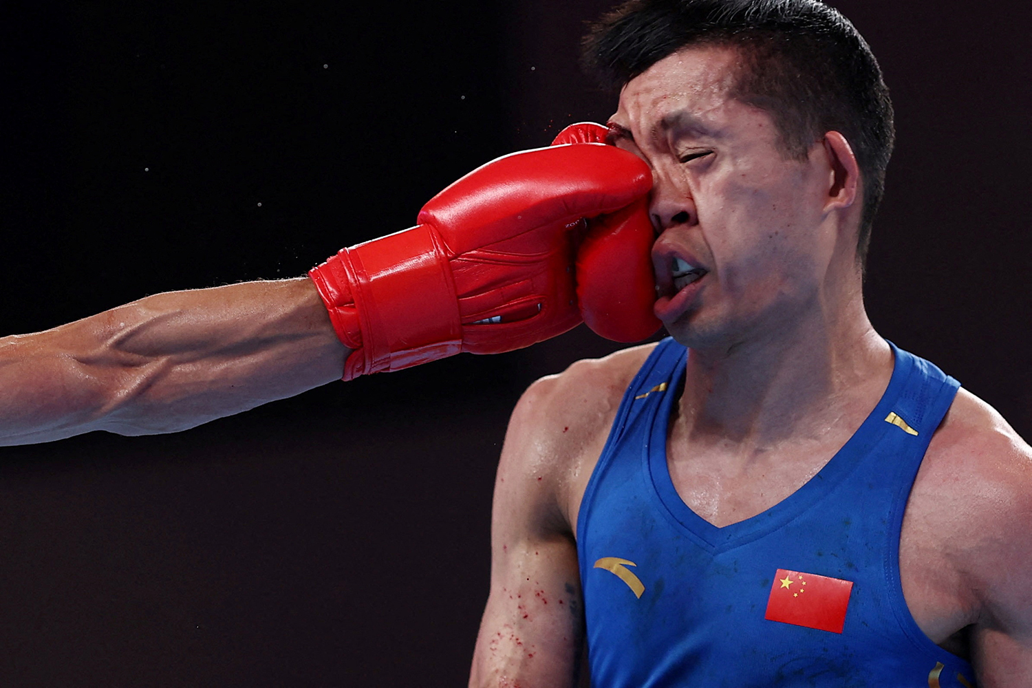 Asian Games - Hangzhou 2022 - Boxing - Hangzhou Gymnasium, Hangzhou, China - October 4, 2023, China's Lyu Ping during his Men's 51-57kg semifinal against Uzbekistan's Abdumalik Khalokov REUTERS/Eloisa Lopez